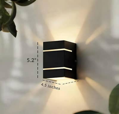 modern black wall lamp with golden accents