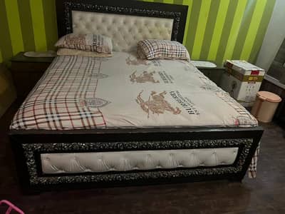 Wooden bed with spring mattress
