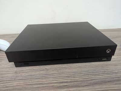 Xbox one x used with 2 controllers and 2 games