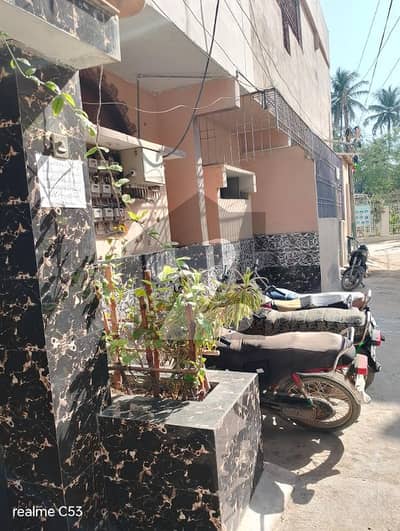 Home for sale 180 SY Ground + 3 RCC Building Rafi Bungalows. Leased , West Open, Corner Rent Value 1.7 Lacs. 13 KE Meters, 3 Gas Meters, 3 Water Tanks.