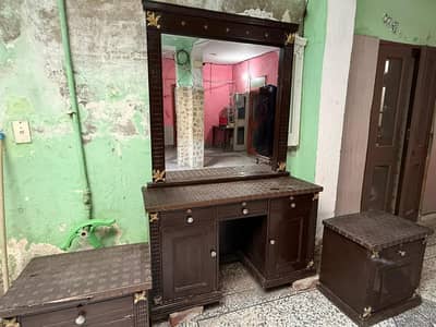 two single bed with dressing and side table