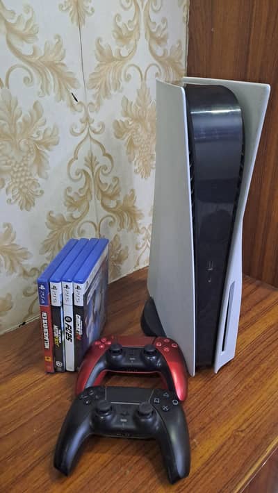 mint condition ps5 with 2 original controllers and 4 games