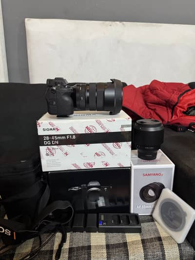 Sony a7iv with sigma 28_45: 1.8 & samyang 85mm 1.4 box and all cables