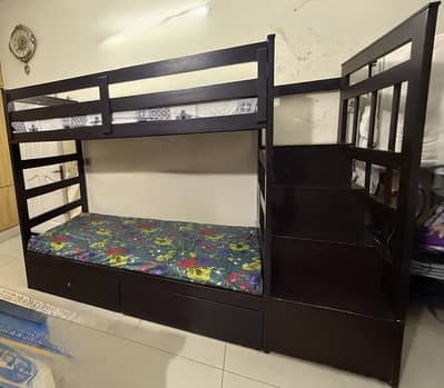 Wooden bunk bed with mattress