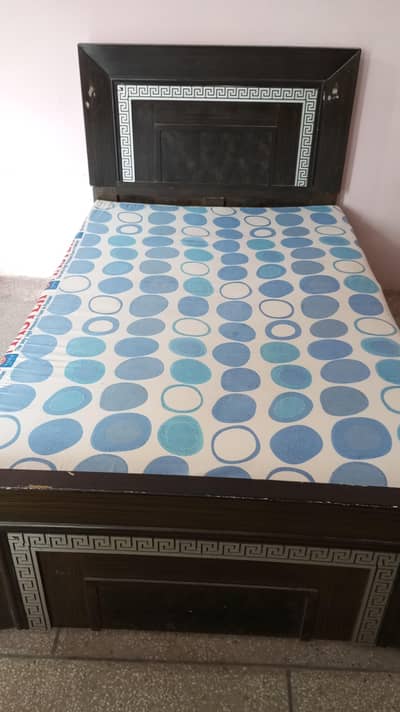 single bed with mattress.