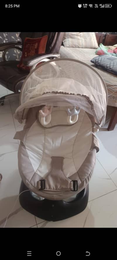 just 2 months used baby electric singing swing on very reasonable pric