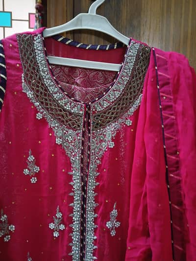 hand  embroidered  gown style  suit. .