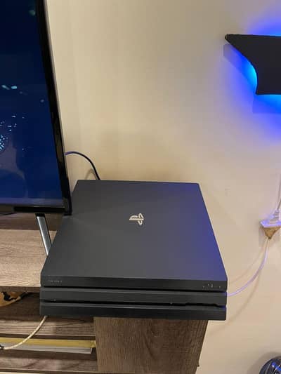 Ps4 pro 1TB plus lots of games.