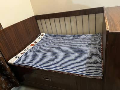 kids bed with mattress and cupboard and tyres and base storage