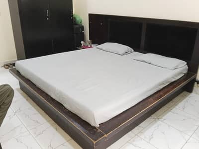 bed with dressing table with side tables