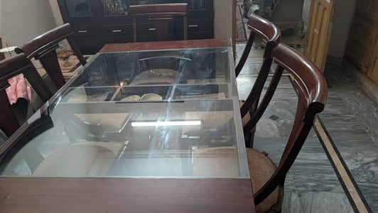 Dinning Table made  with sheesham wood and is also. with 6 chairs.