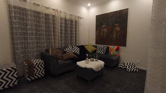 7 seater L-shaped sofa, 2 ottoman square shape stools, 10 cushions