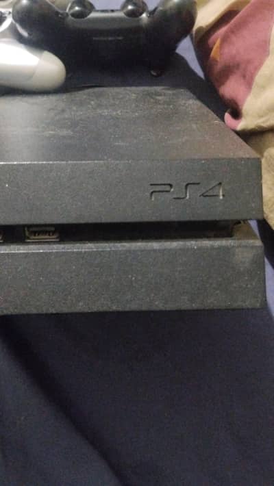 Ps4 fat edition in good condition slightly used with 2 controllers .
