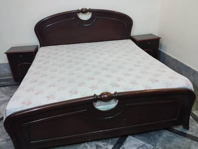 Bed with side tables and dressing table