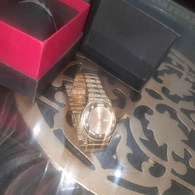 Golden wrist watch for men in golden colour.   Barely used,