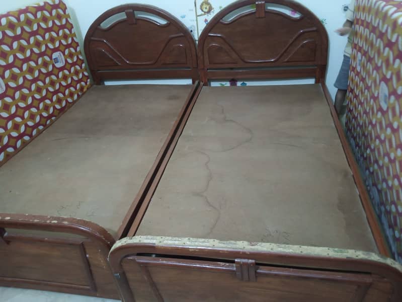 Two single bed used we will decrease price 1