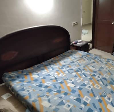 Wooden queen size bed with side tables