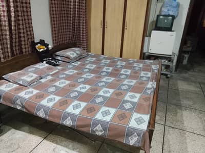 two single beds made of wood in good condition