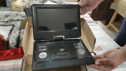 1. Portable DVD Player 2. Tinwe CD Player with FREE CD's and DVD's