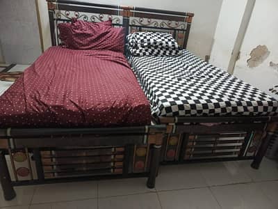 Three single Iron beds for sell with spring mattress of Al Khair
