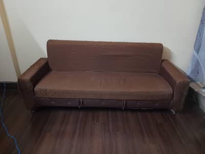 Sofa turns into a bed and also has storage space