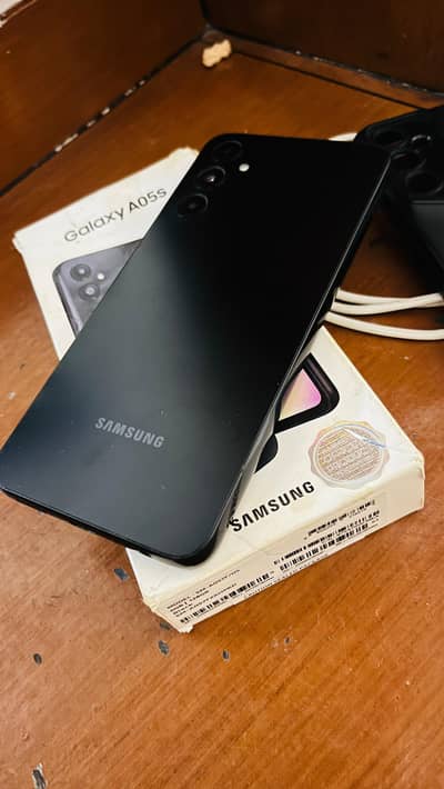 Samsung a05s.  Box with data cable