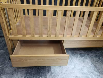Very less used baby cot , large size