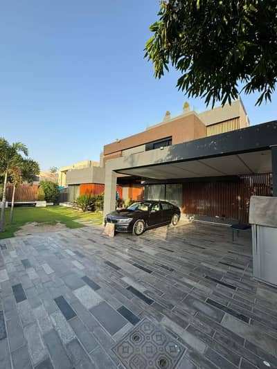 2 Kanal Slightly Used Luxury Ultra-Modern Design Most Beautiful Bungalow For Sale at Prime Location of DHA Lahore Near To Park Masjid & Commercial Market .