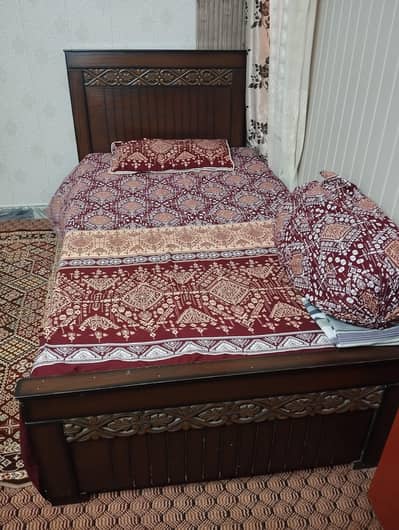 single wooden bed