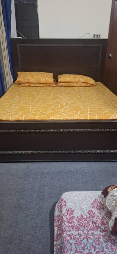 brown wodden bed