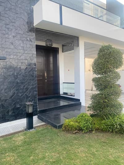 Stunning 1-Kanal Modern Luxury Bungalow for Sale in DHA Lahore Phase 7 Block Q 5 Master Bedrooms, 2 TV Lounges, 2 Modern Kitchens, Spacious Drawing & Dining, Terrace, Independent Access Easy Deal with Motivated Seller by Buttar Estate and Groups