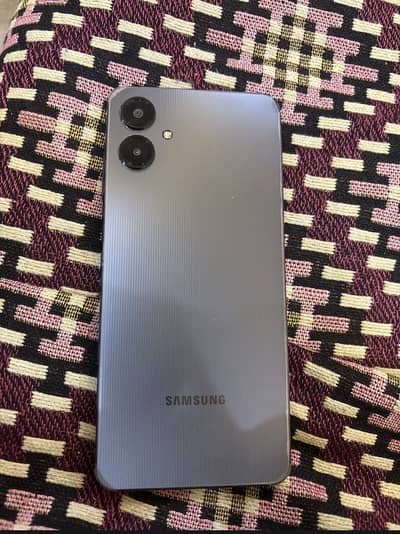 Samsung a06 4/64 10/10 condition with 11 months warranty 1 month used
