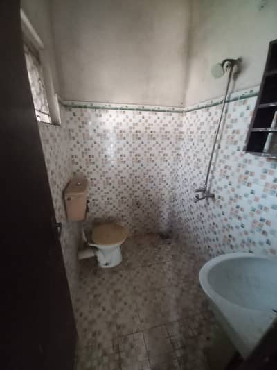 10 Marla double story separate house for office use and godam at prime location.