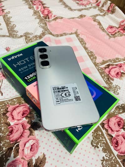 infinix hot 60i 6+6/128 complete saman 10/10 condition 10monts warnty