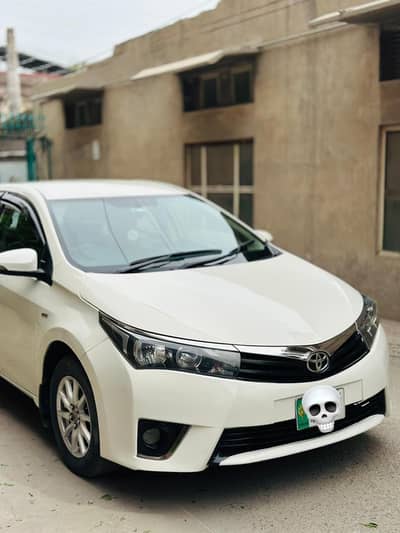 Corolla Gli 2014 model white color neat and clean almost total genuine