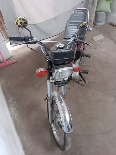 Black Honda 125 modal 2012 number 2999 rigs Tretion Multan ki h ok