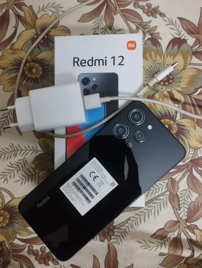 REDMI 12 with complete box and charger