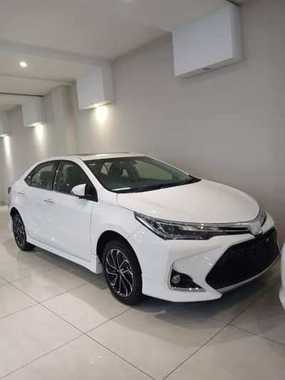 Toyota Corolla Altis Grande 1.8 2026 white with black zero metre