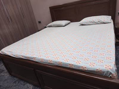 interwood bed with side tables