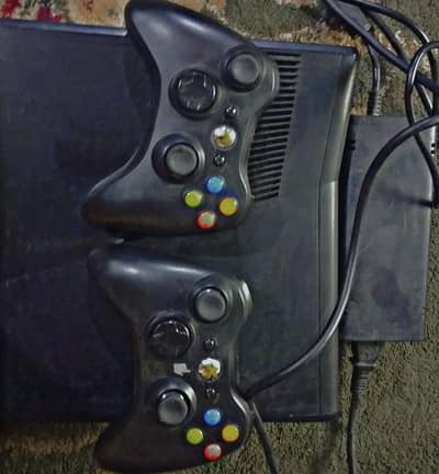 Xbox 360 slim original box and 2 wireless controller with 60 games