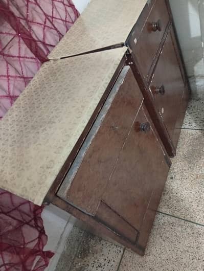 a pair of bed side tables