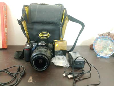 Nikon D3100, 18-55mm VR lens, SD card, Charger, Battery, 2 Data cables