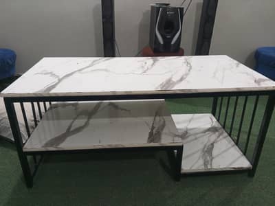 very big in size center table. . triple story table