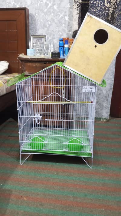 Set of cage and nest box for sale with perch and a swing