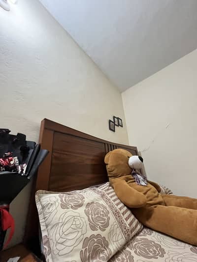 King size bed without mattress with one side table