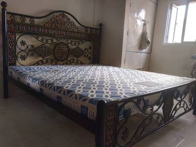 Iron King-size bed with mattress