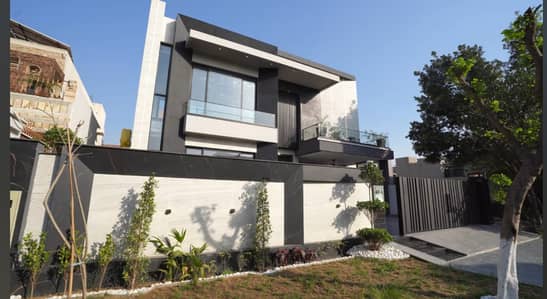 One Kanal Brand New Luxury Ultra-Modern Design Most Beautiful Fully Furnished Bungalow 2 Servant Quarter In Basement For Sale At Prime Location Of DHA Lahore Near To Park Masjid & Commercial Market.