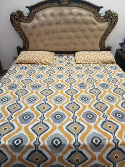 wooden bed and side tables