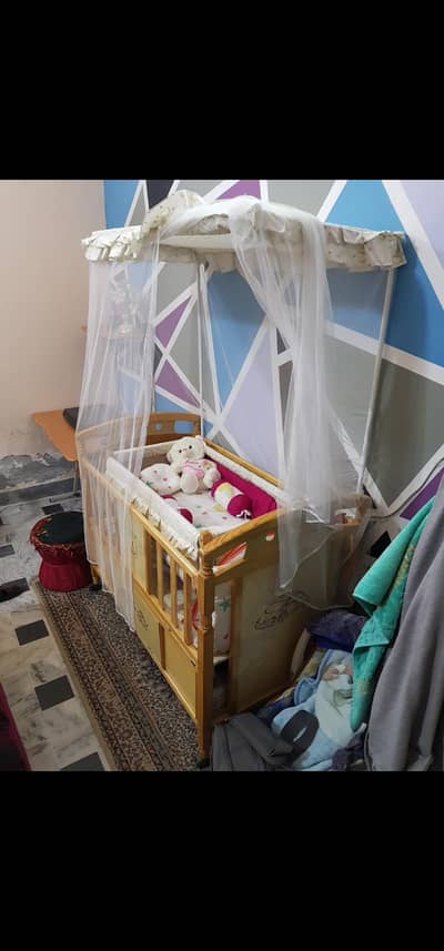 Large baby cot with swinging crib