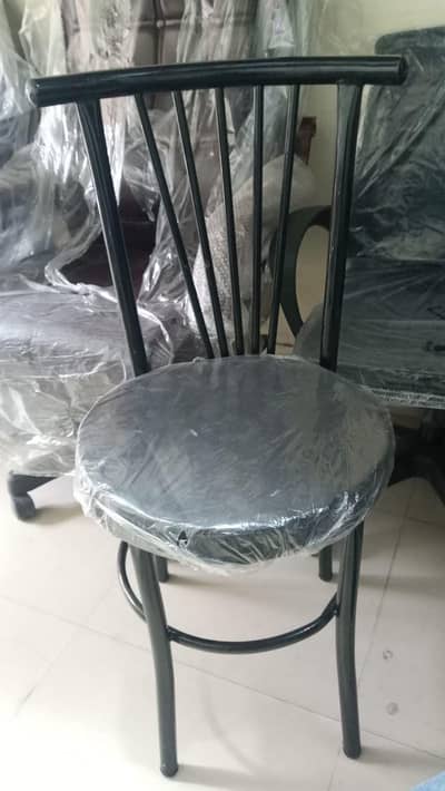 unused steel chairs with cushioned seats